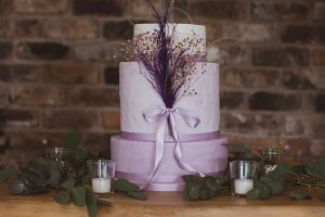 three tier lilac and mauve wedding cake