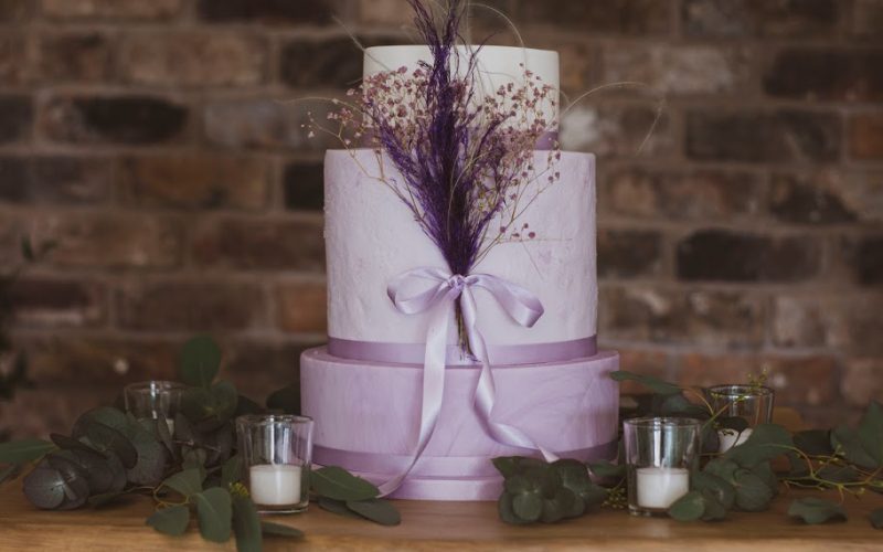 three tier lilac and mauve wedding cake