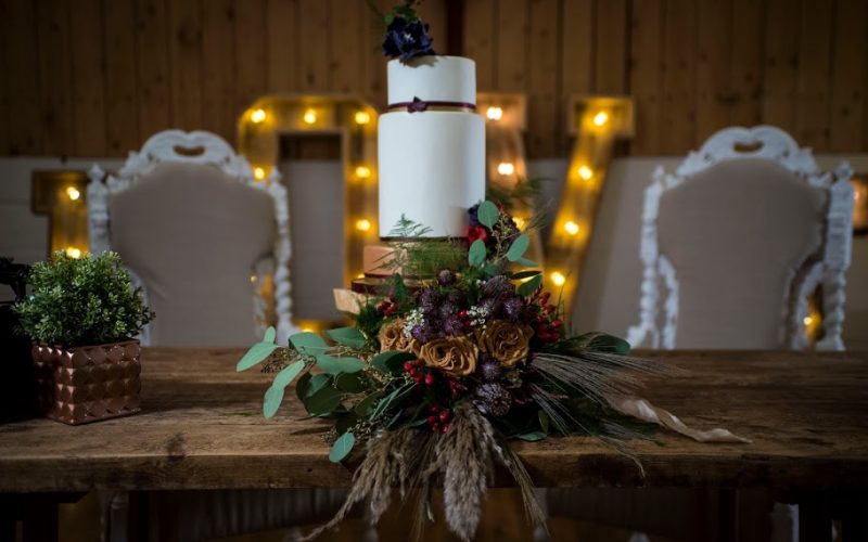 three tier wedding cake with bouquet